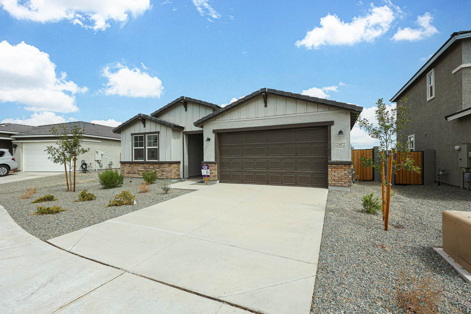 A driveway leading to a house.