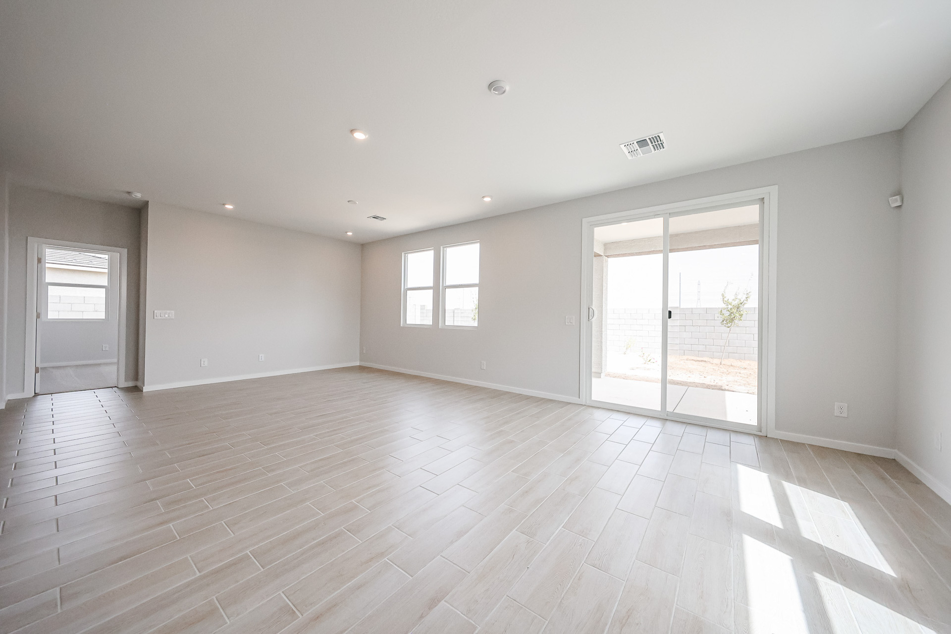 A room with a wood floor and a wood floor.