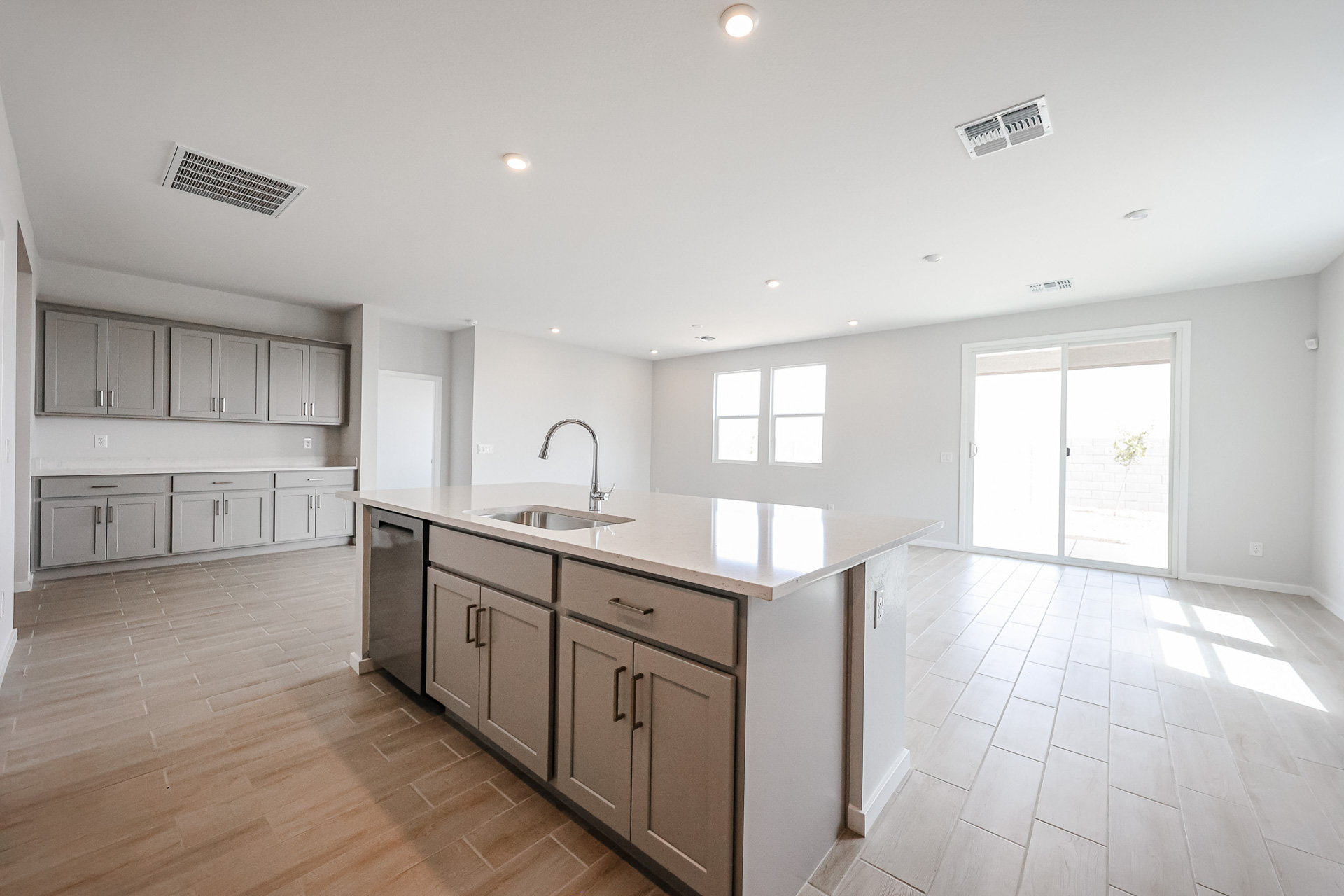 A kitchen with wooden cabinets.