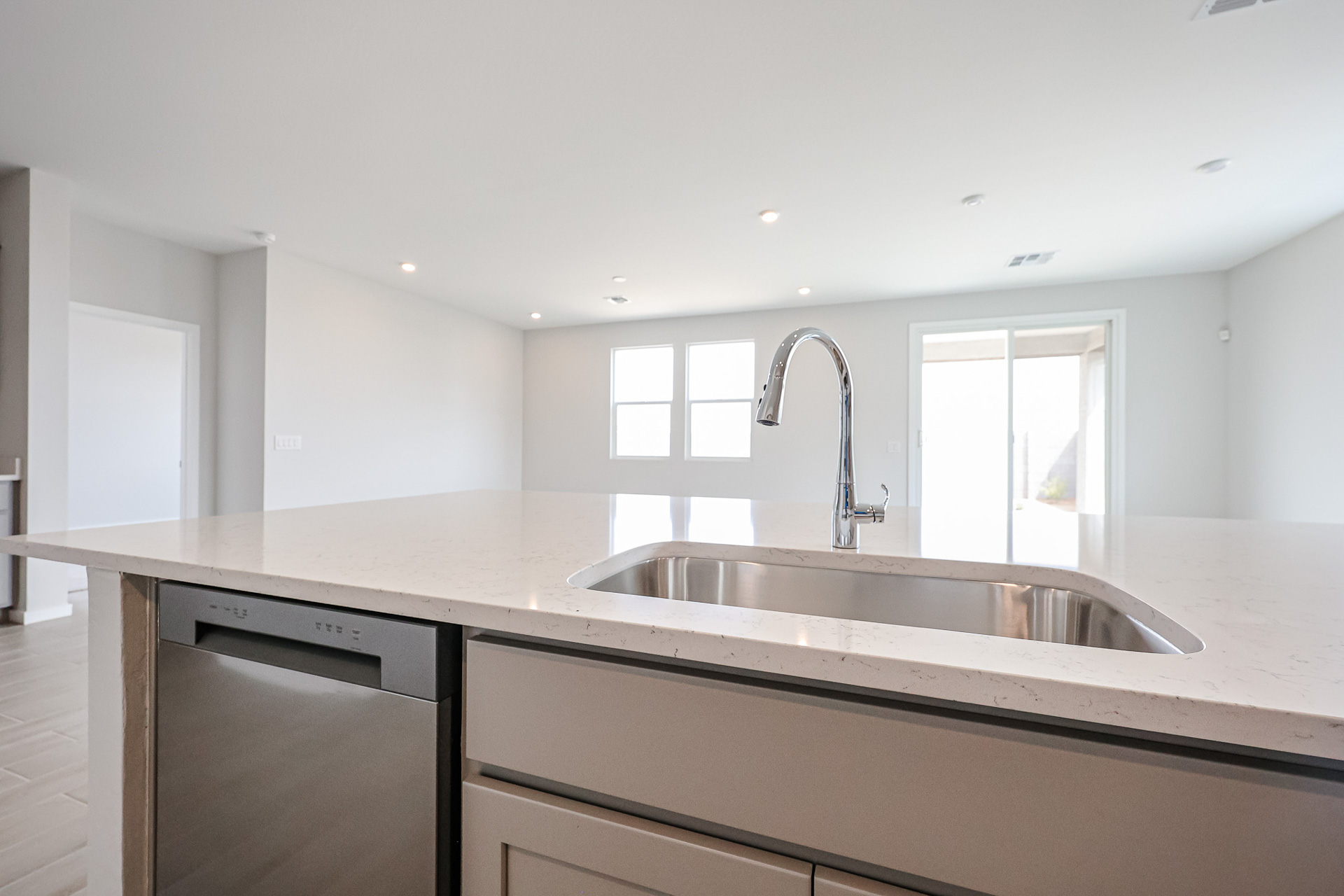 A kitchen with a sink and a counter top.
