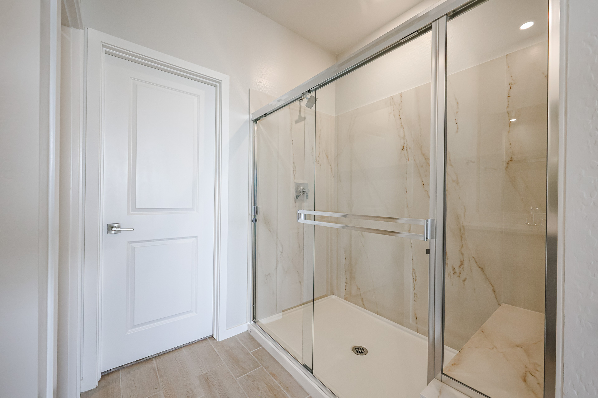 A bathroom with a glass shower.
