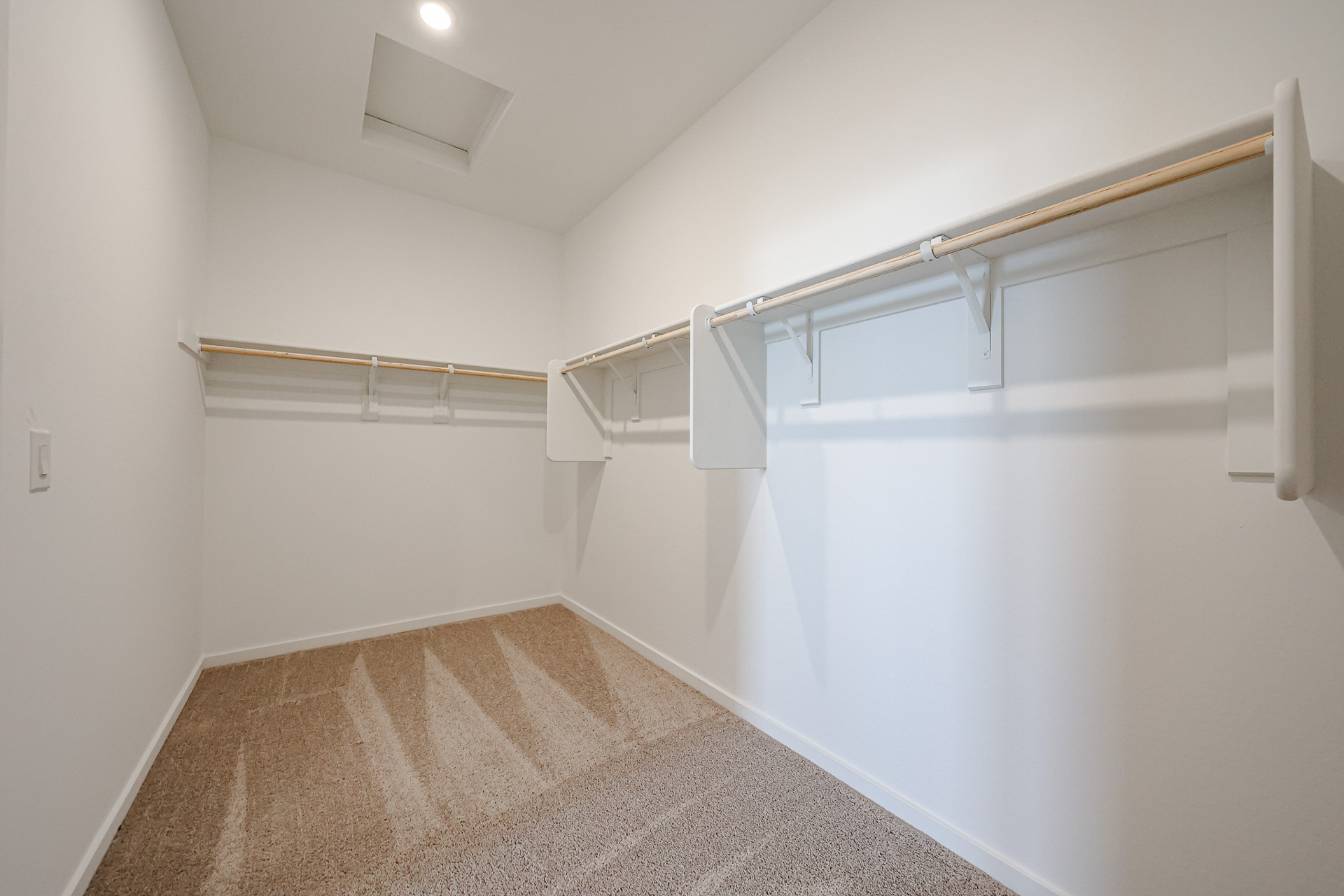 A white staircase in a room.