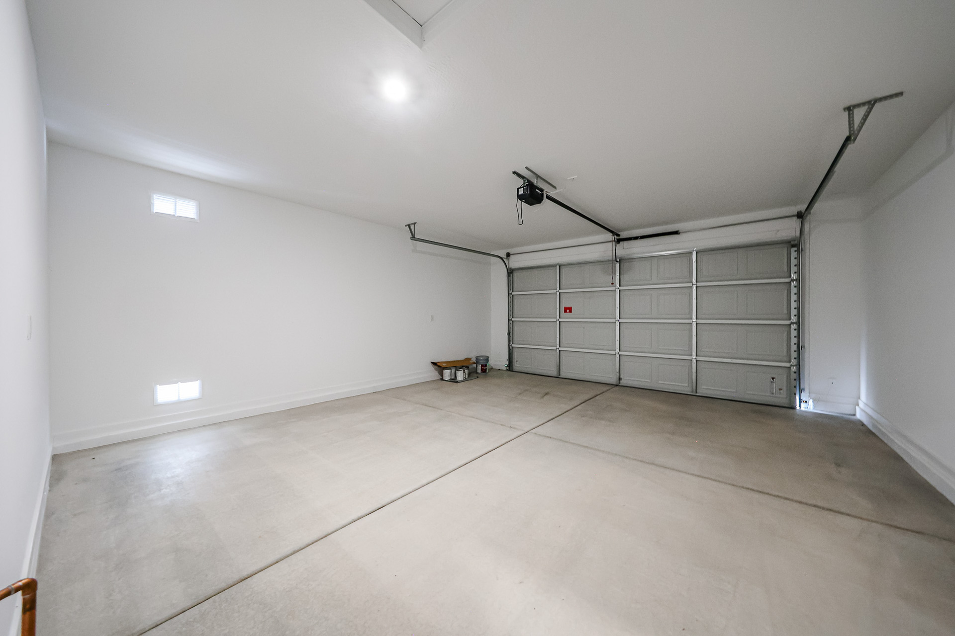 A room with a metal gate.