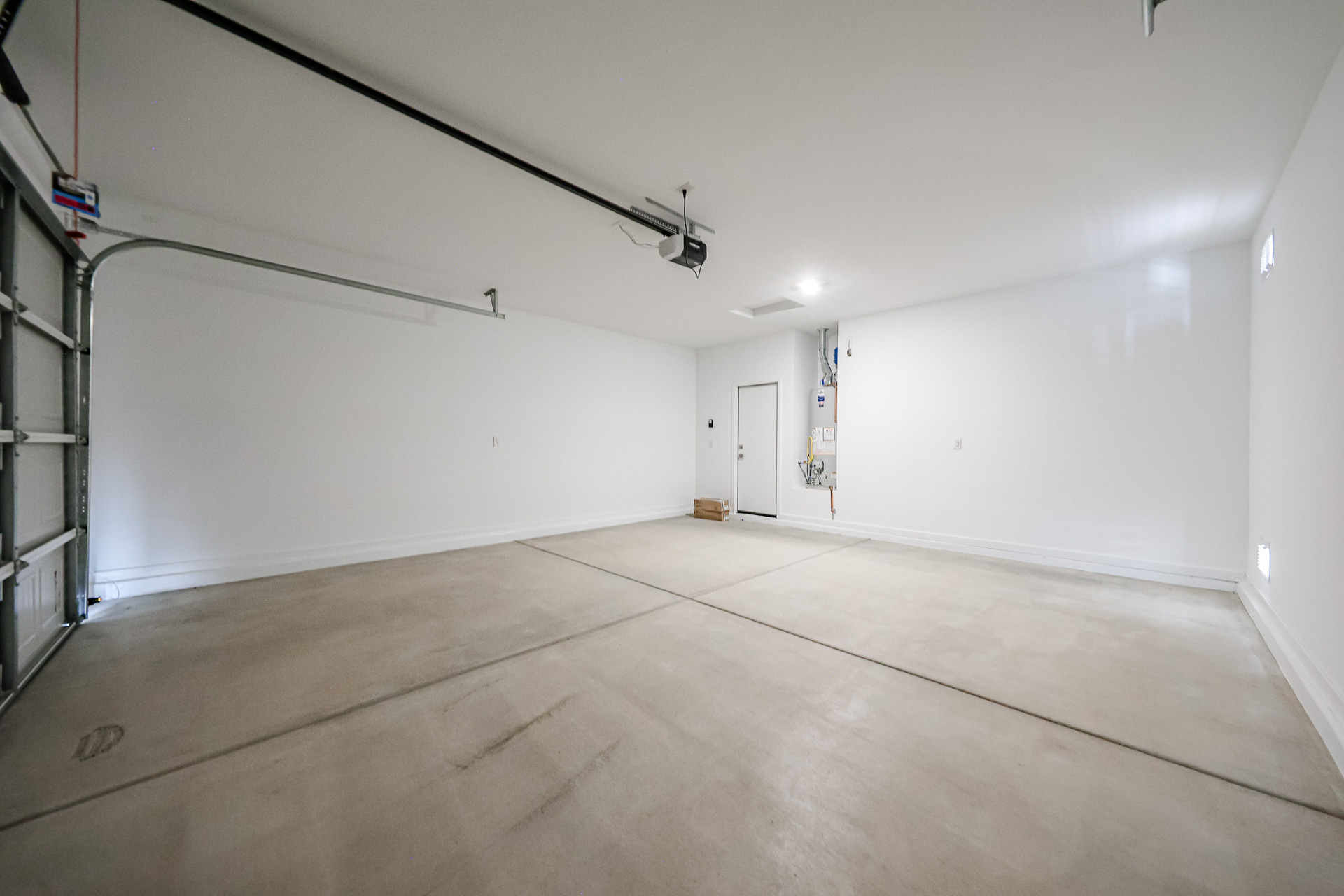 A hallway with white walls.