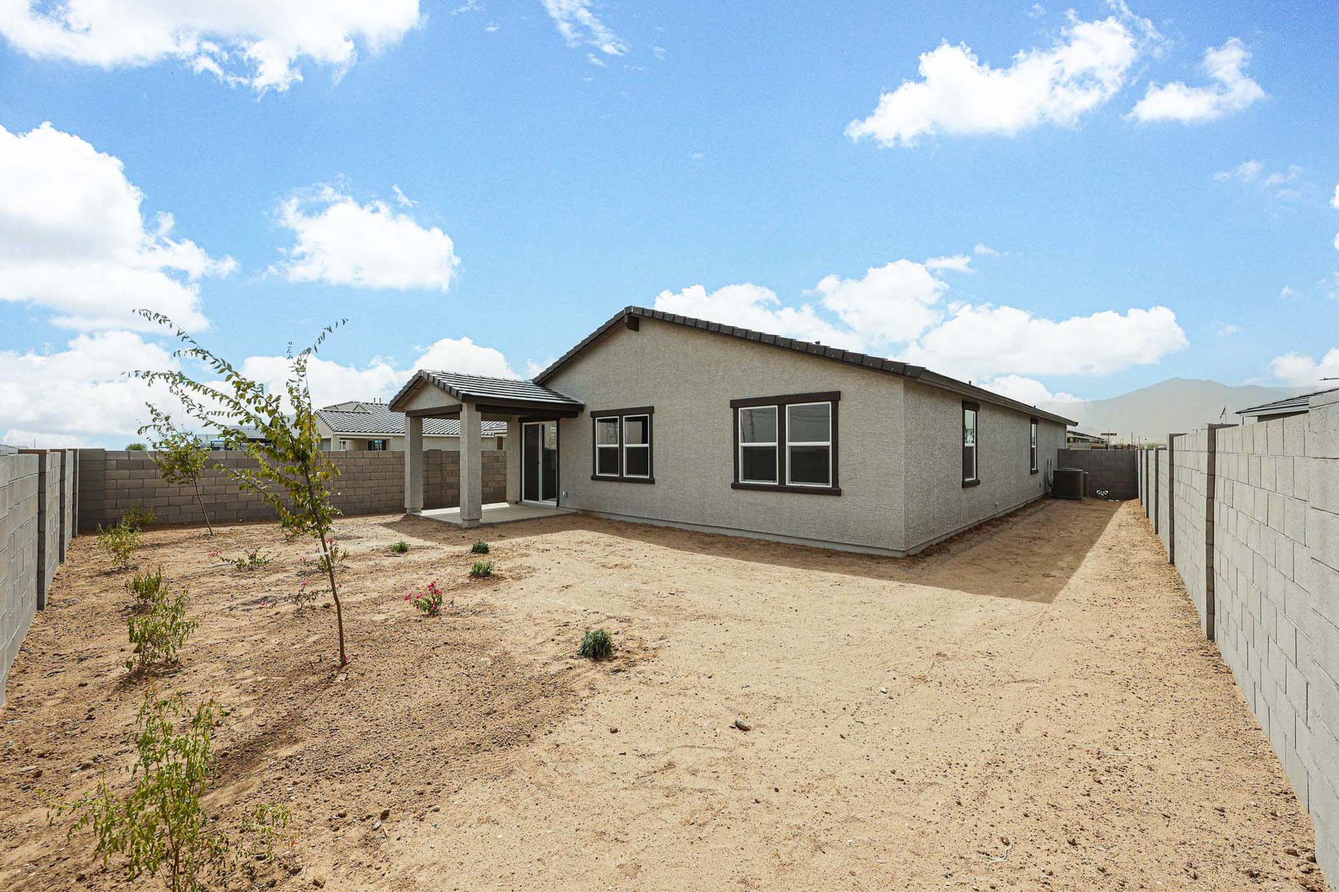 A house in a dirt field.