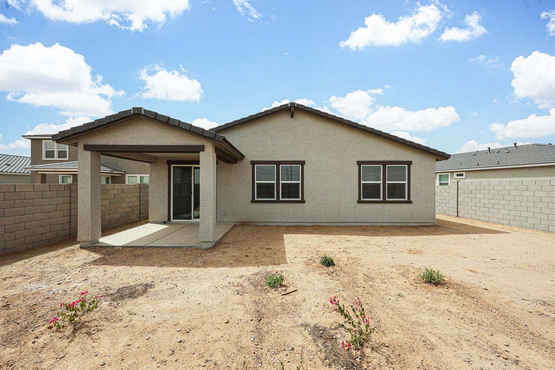 A house with a dirt yard.