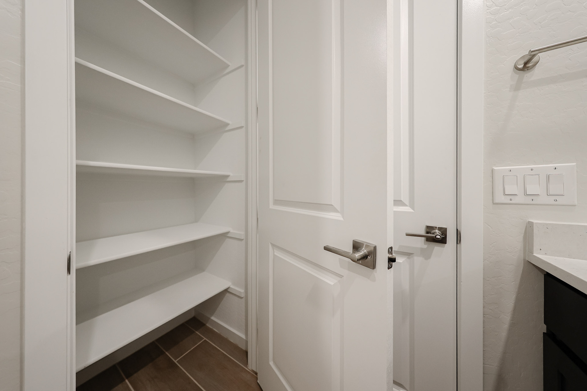 A white cabinet in a room.