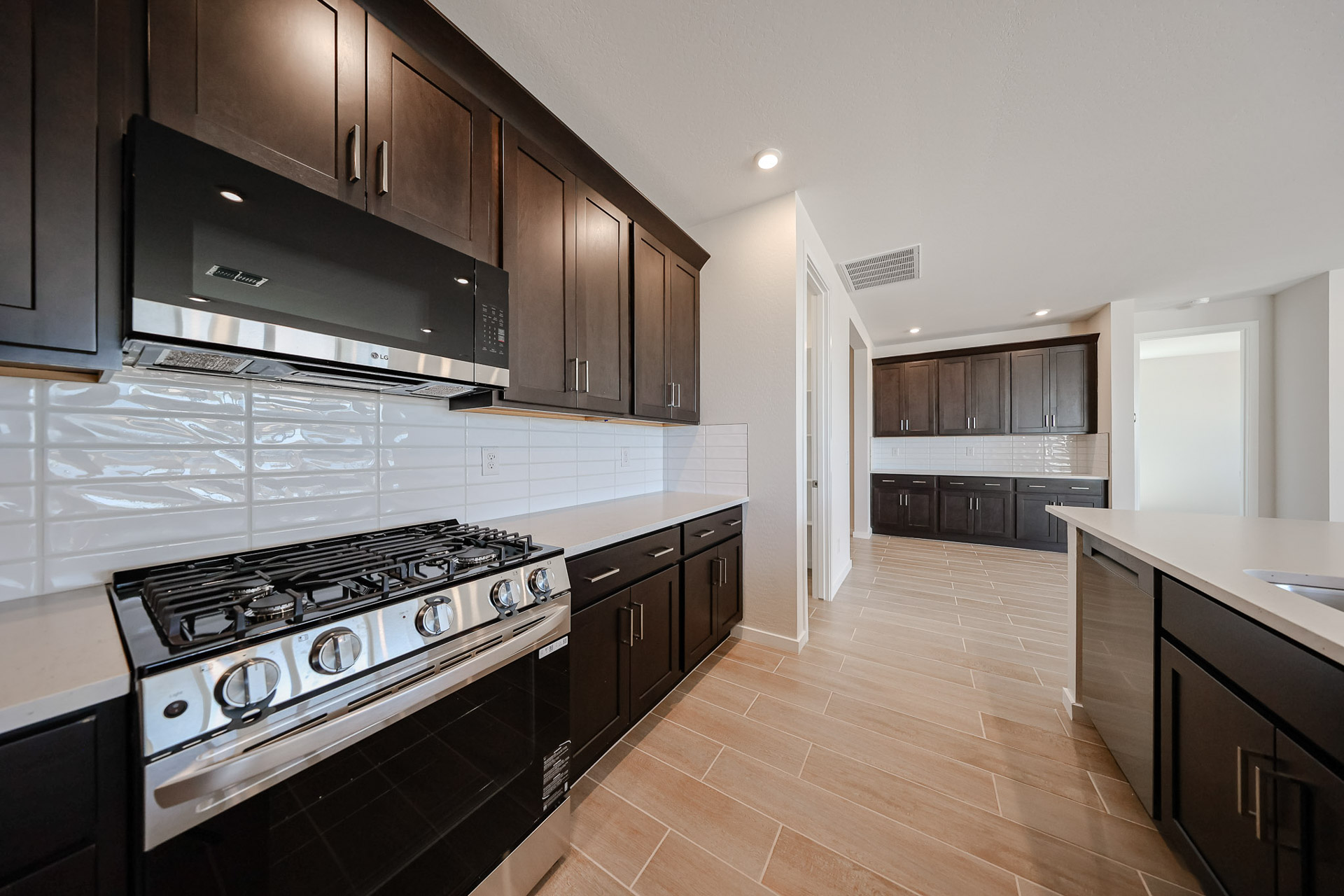 A kitchen with black cabinets.