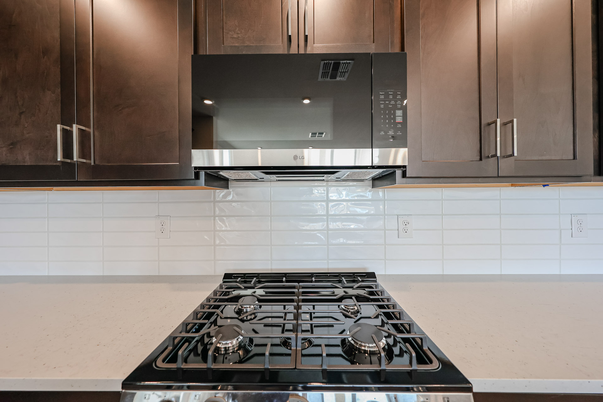 A kitchen with a stove and oven.