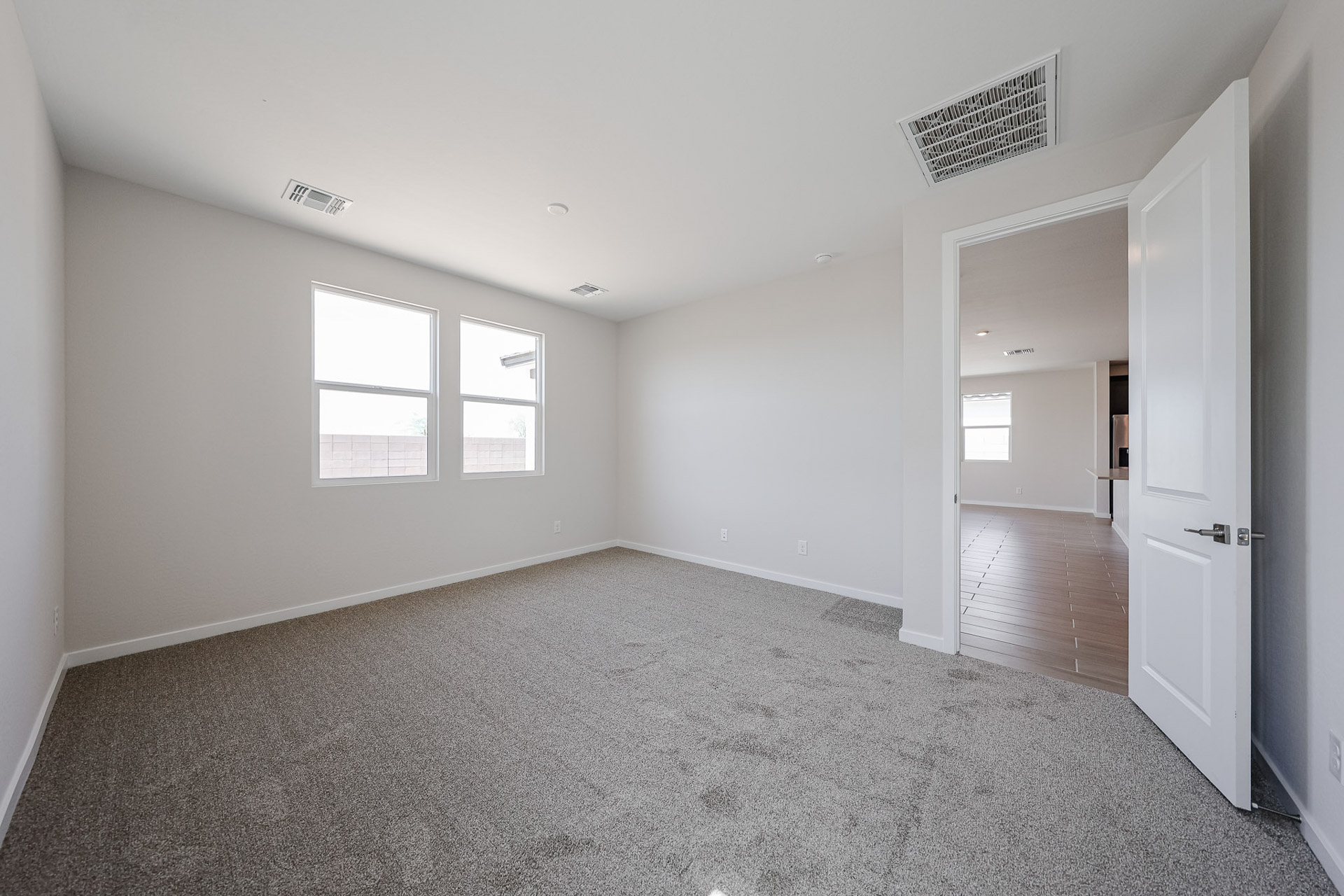 A hallway with white walls.
