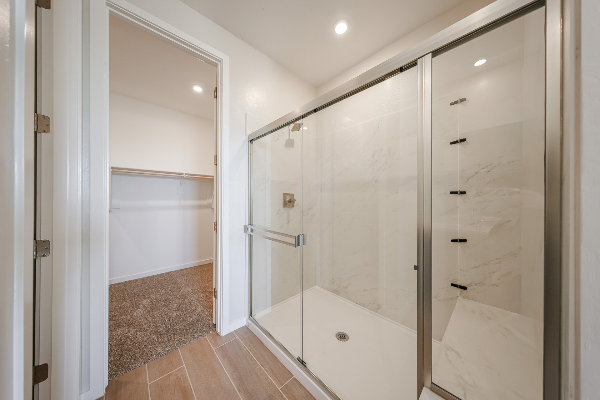 A bathroom with a glass shower.