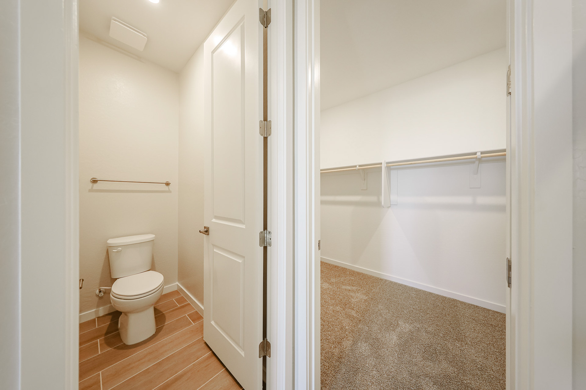 A bathroom with a toilet and bathtub.