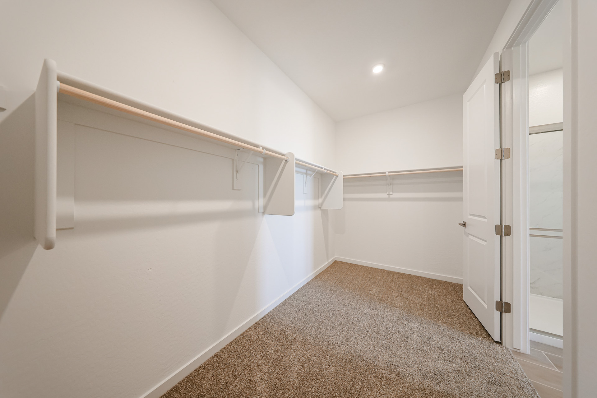 A hallway with white doors.