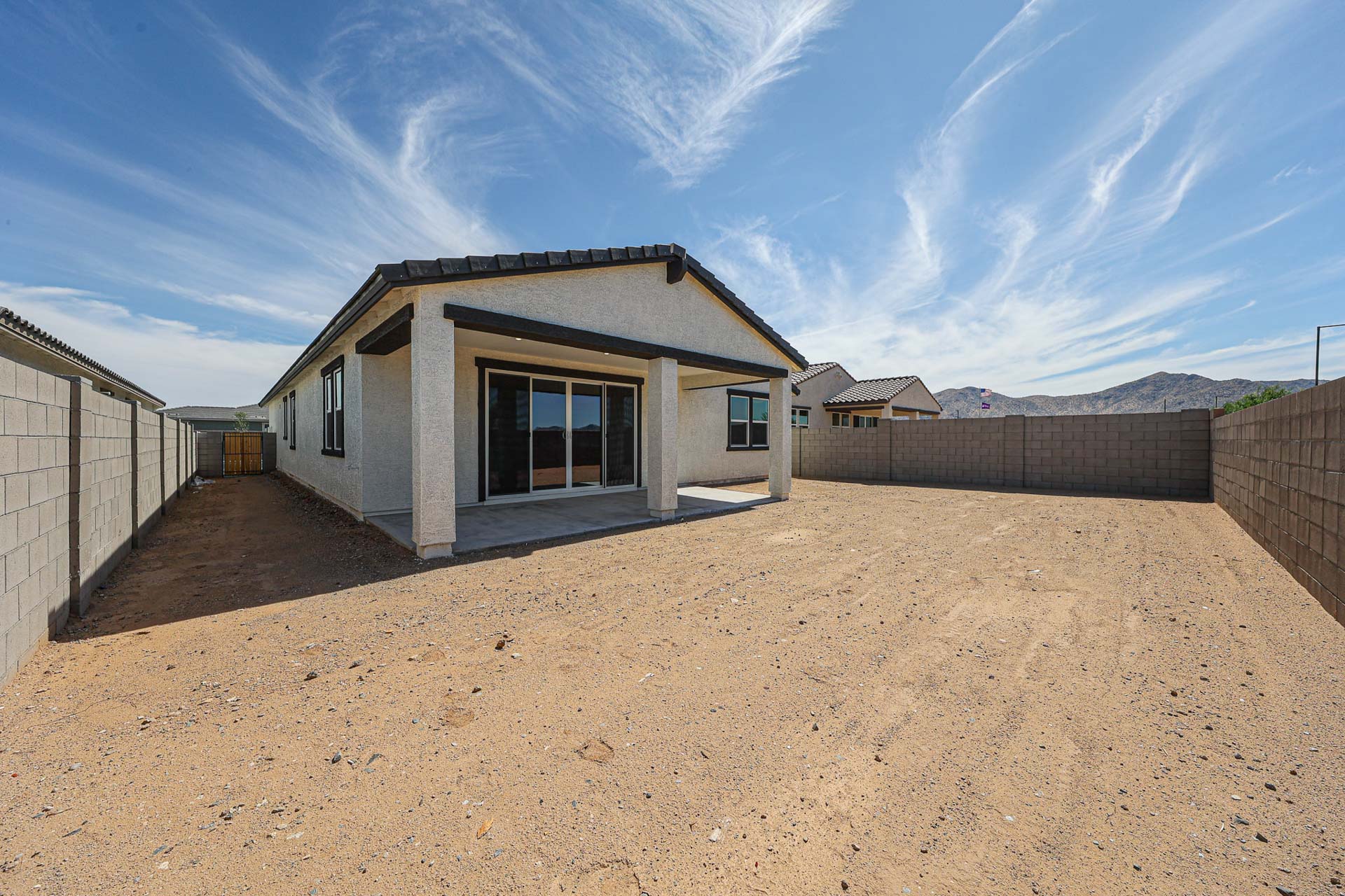 A house in a dirt field.