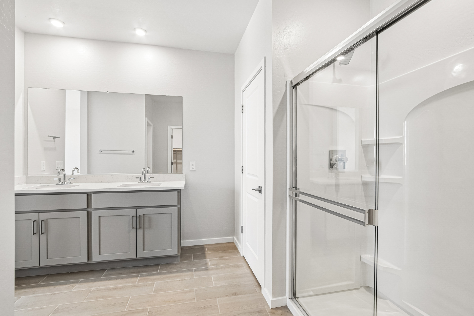 A bathroom with a glass shower.