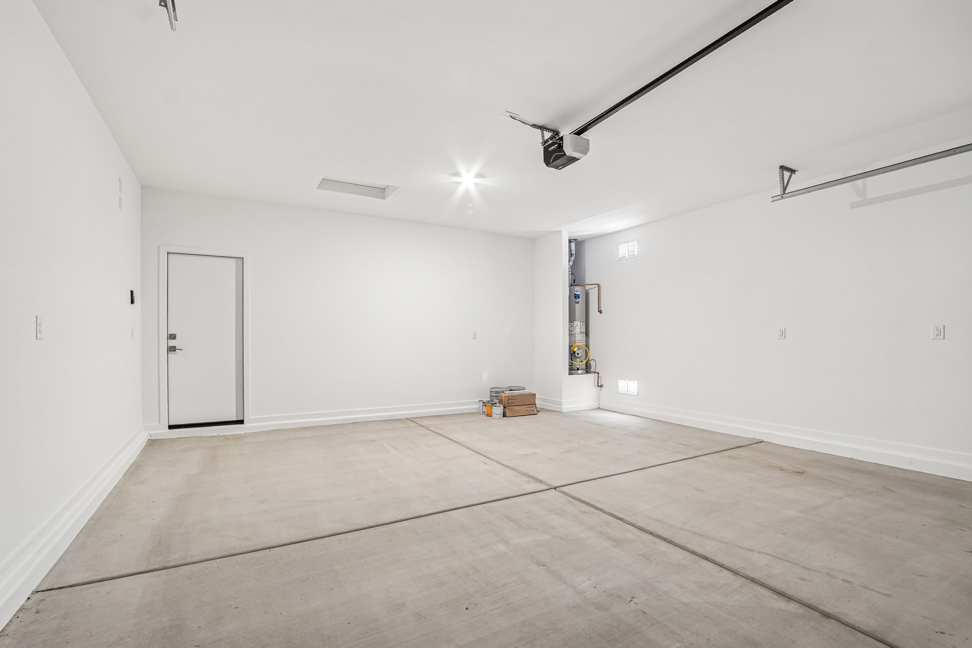 A room with a wood floor and white walls.