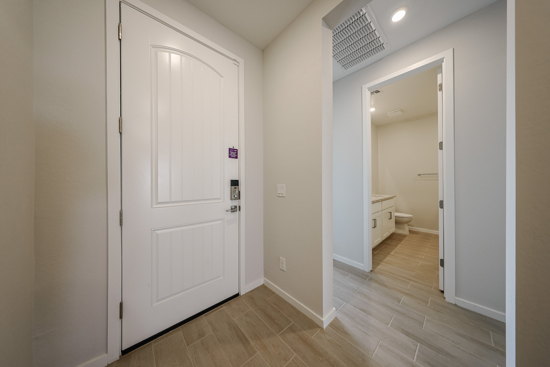 A bathroom with white doors.