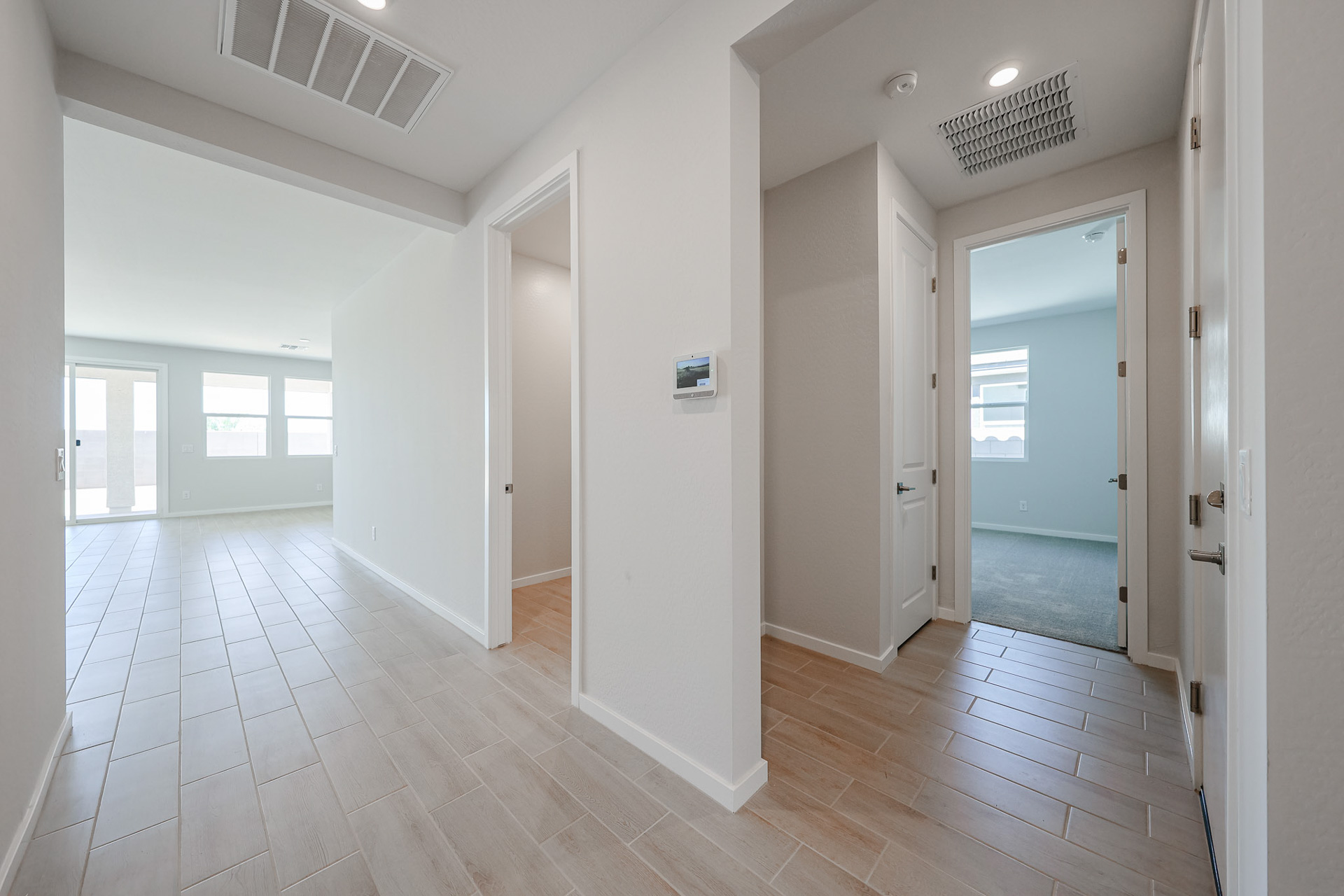 A hallway with white walls.
