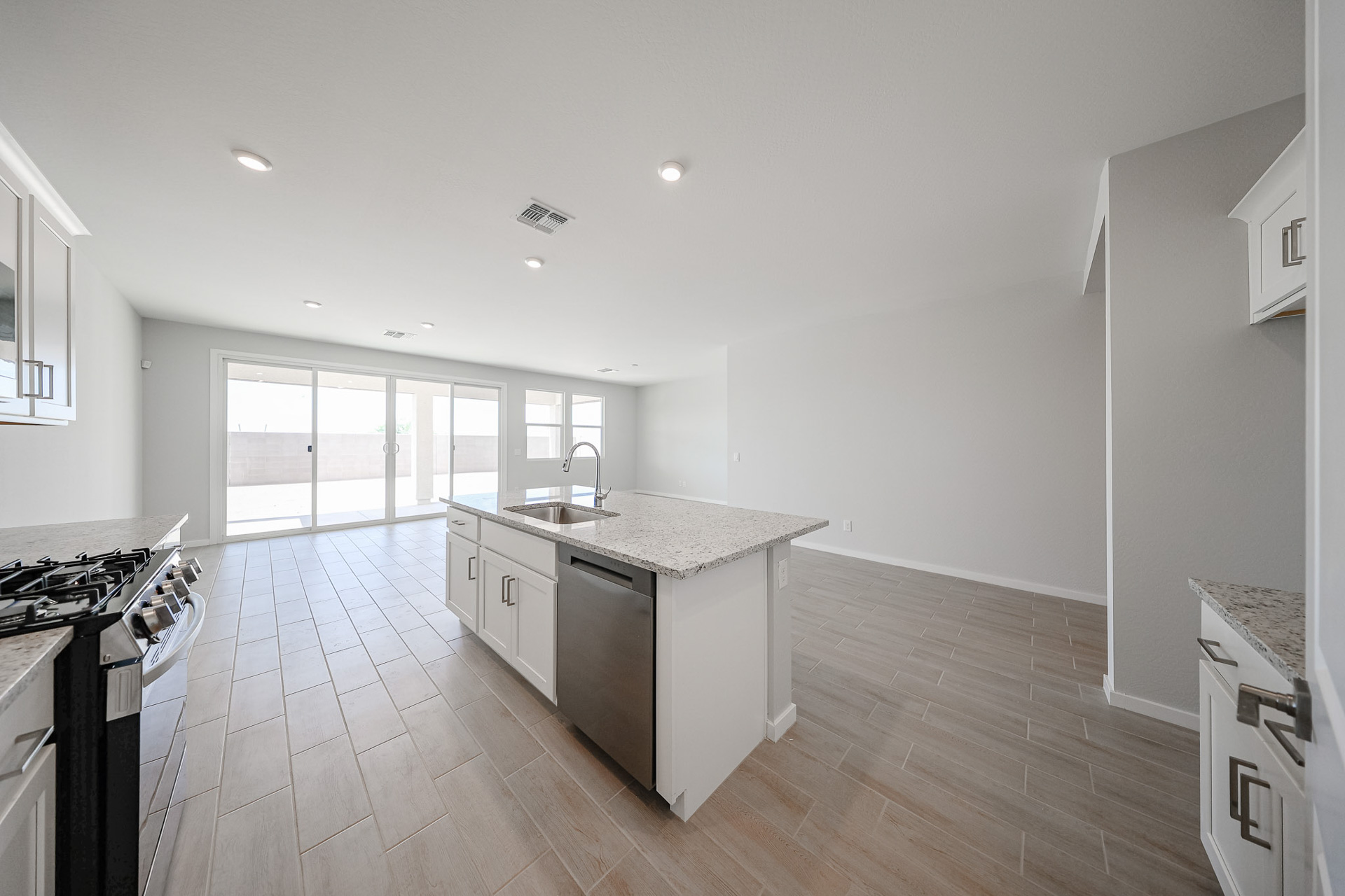 A kitchen with a wood floor.