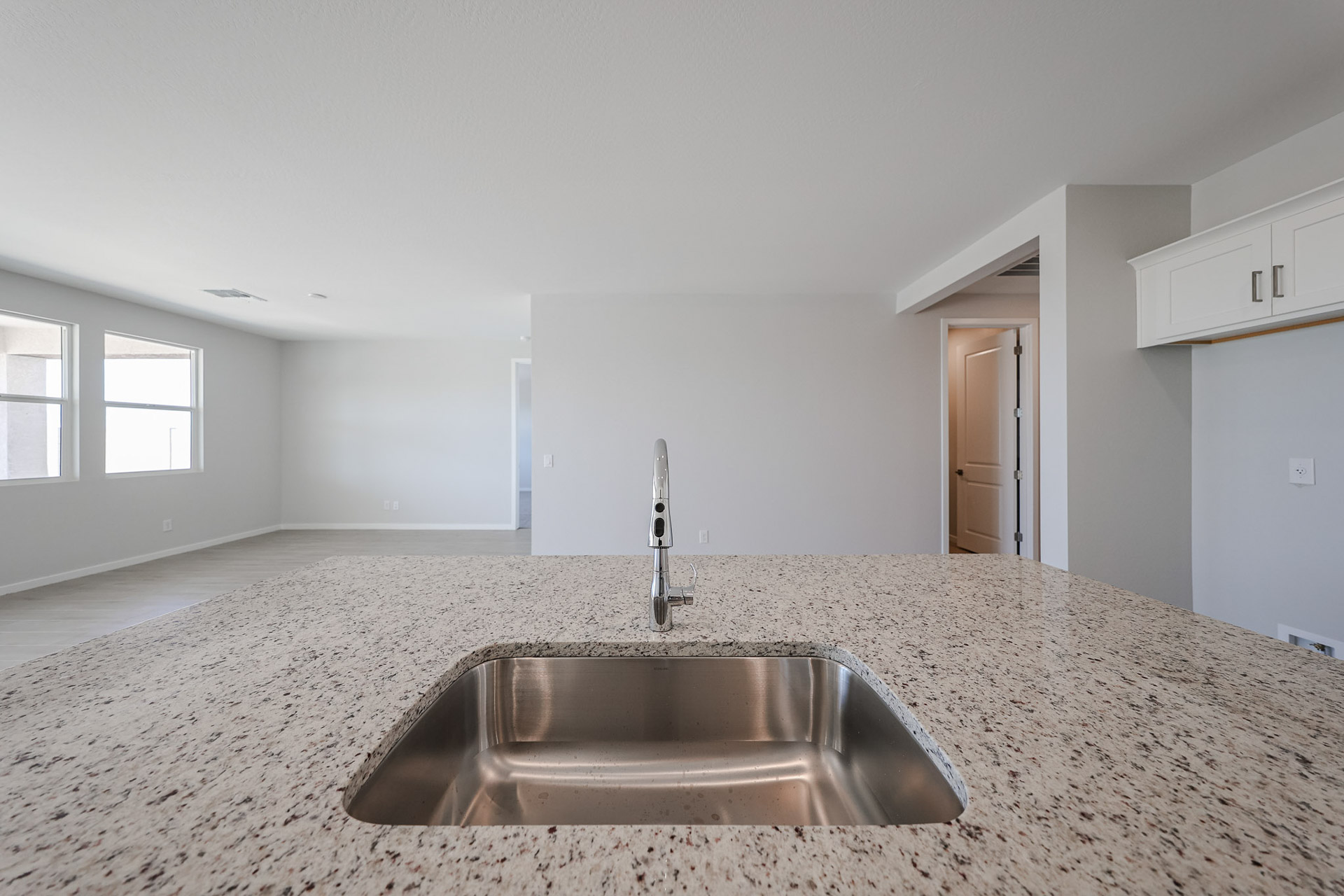 A kitchen with marble counters.