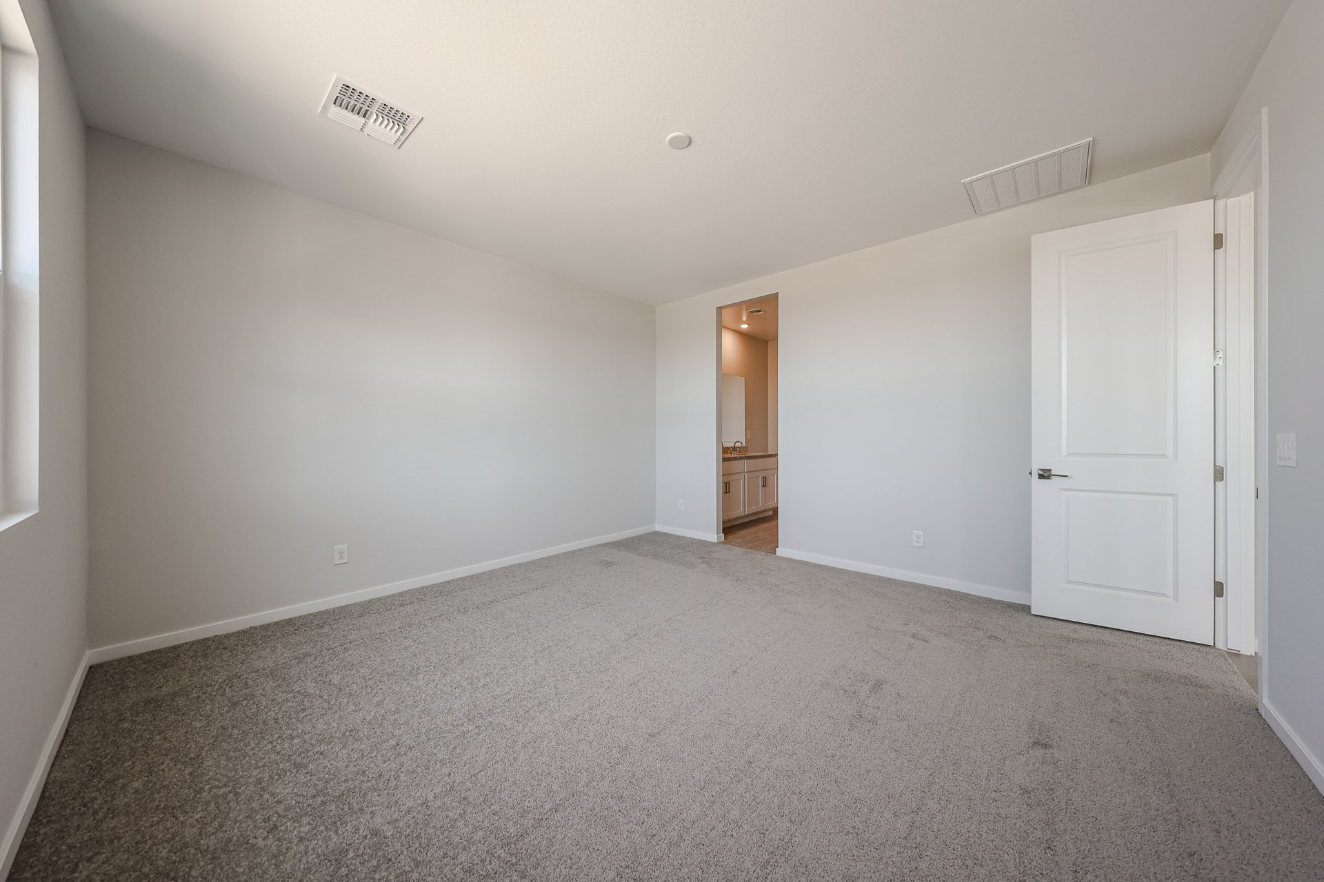 A hallway with white doors.