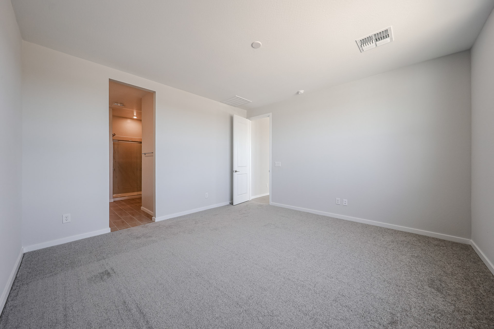 A hallway with white walls.