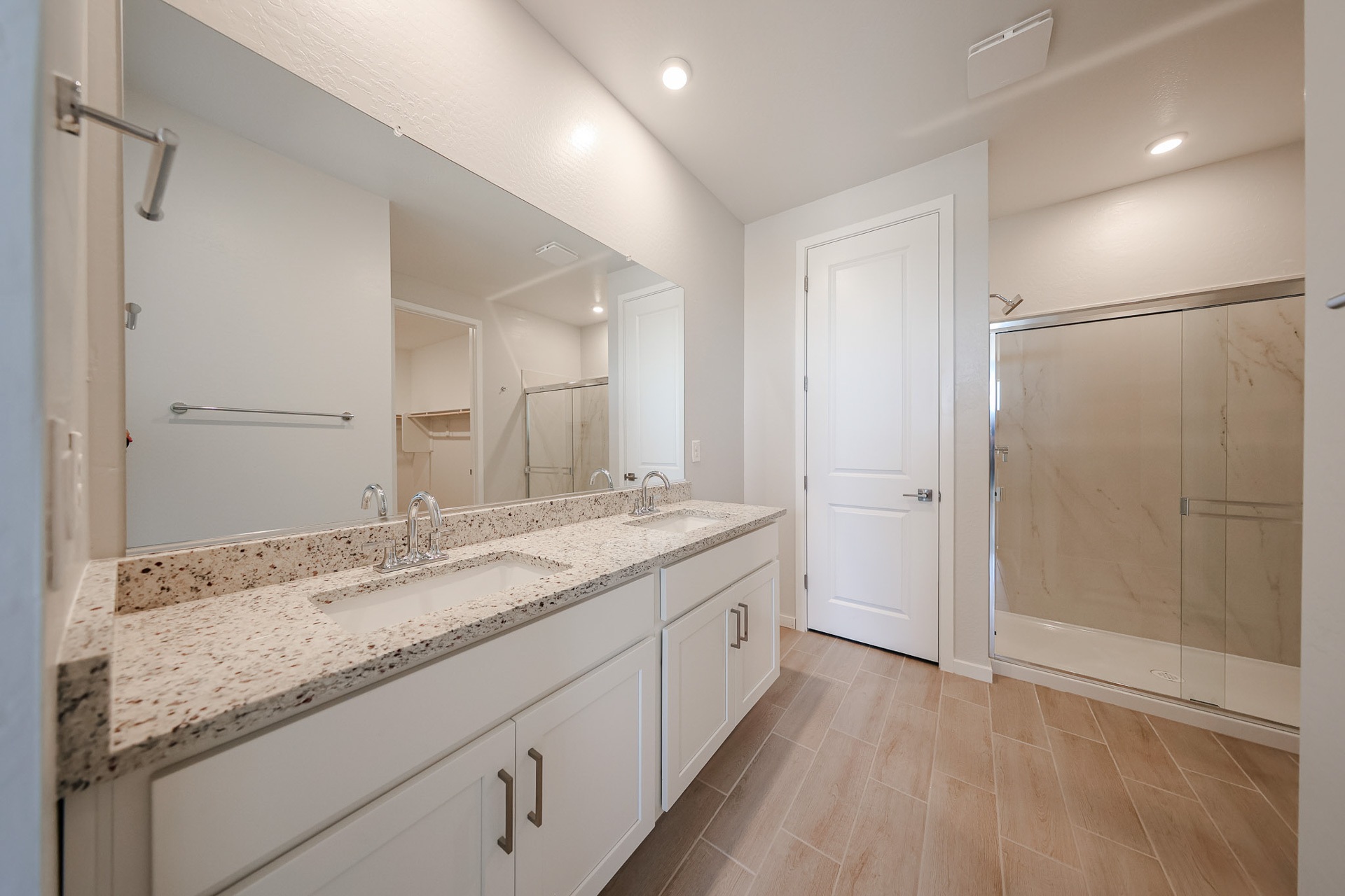 A bathroom with a marble countertop.