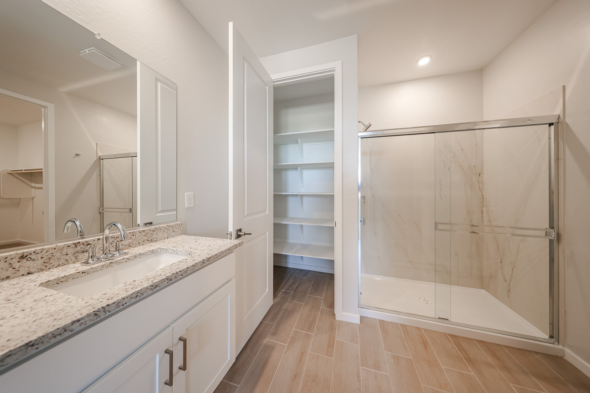 A bathroom with a glass shower.