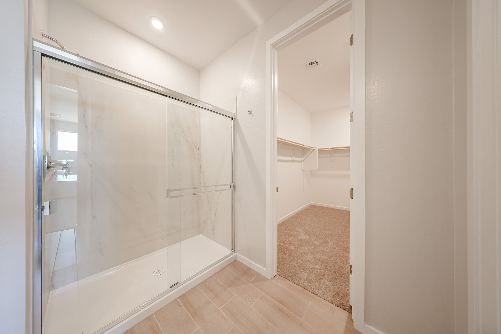 A bathroom with a shower unit.