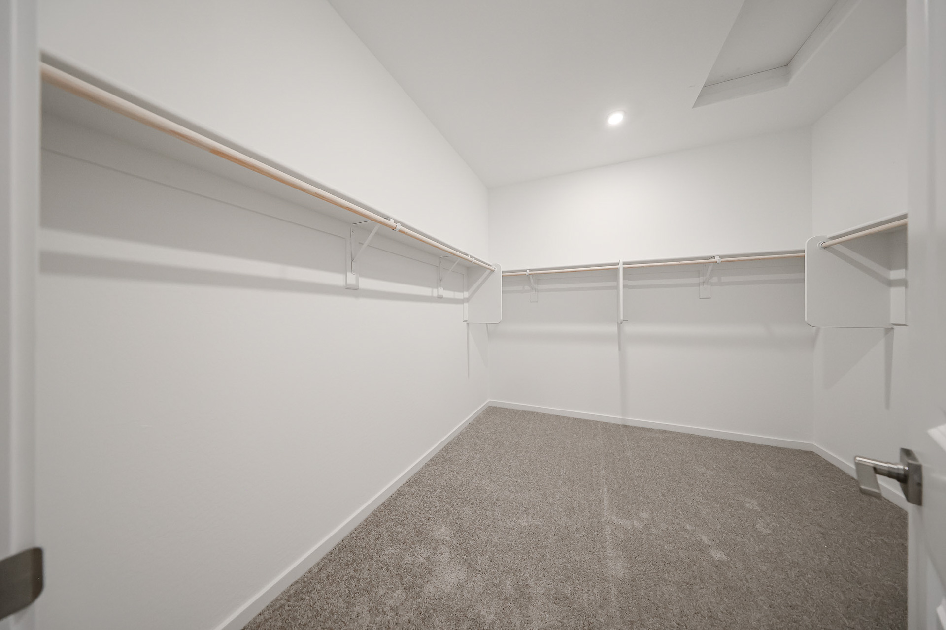 A white room with a grey floor.