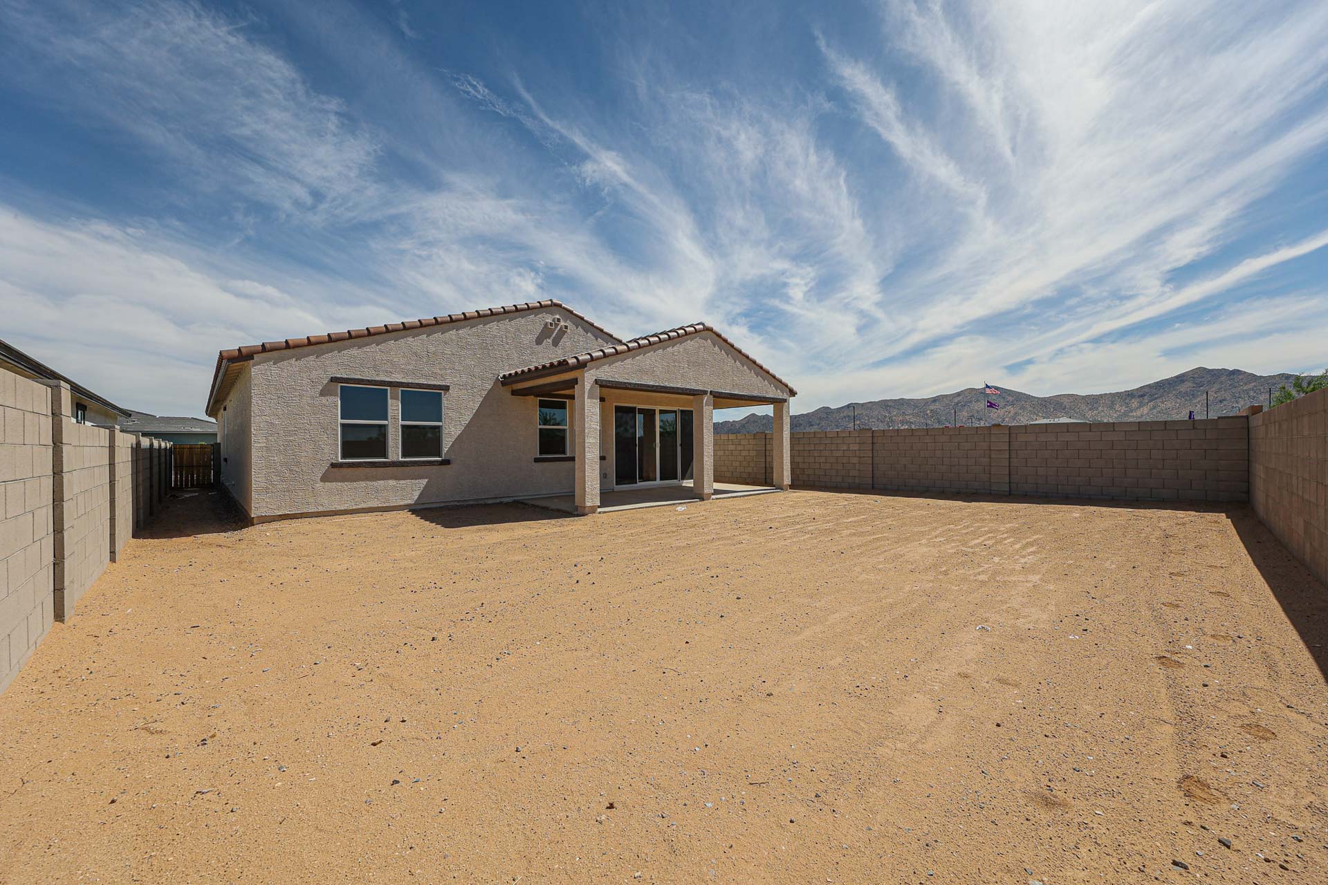 A house in a dirt field.