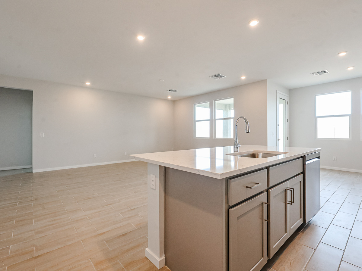 A kitchen with a marble countertop.