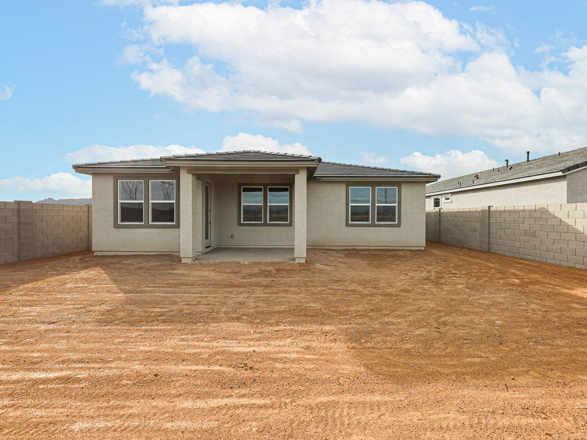 A house with a dirt yard.