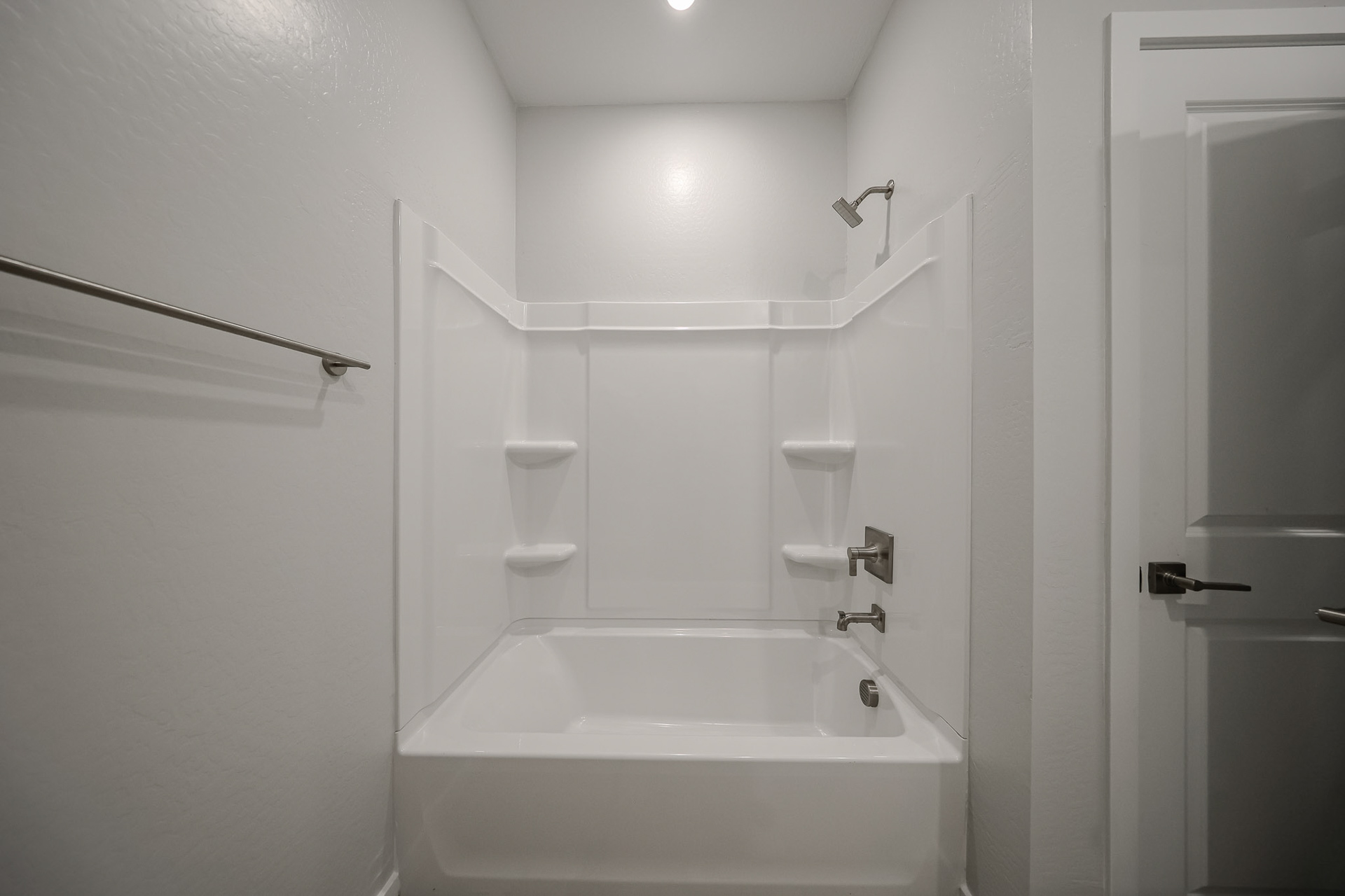 A bathroom with a tub and sink.