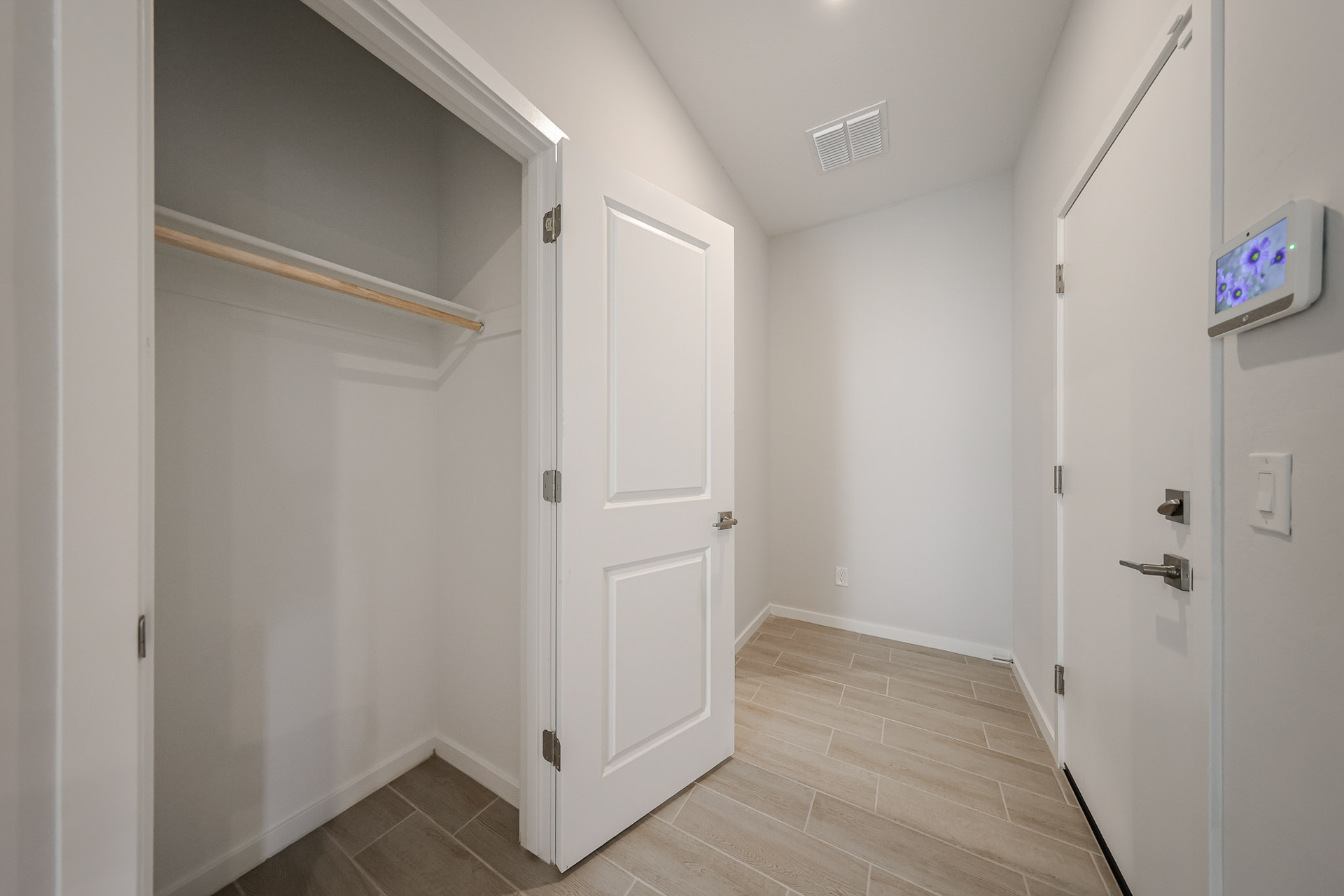 A hallway with white doors.