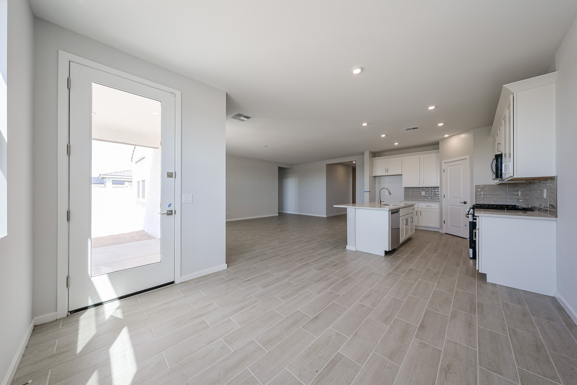 A large kitchen with white cabinets.