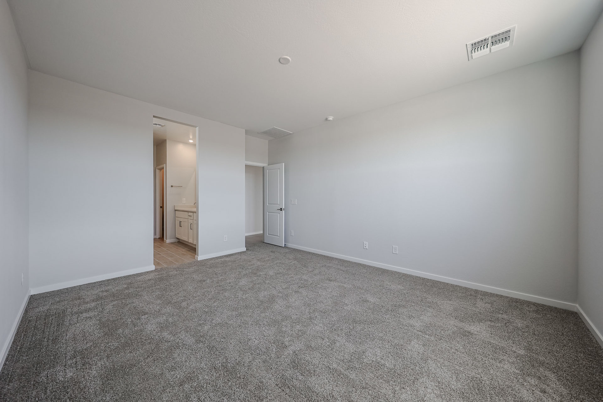 A long hallway with white walls.