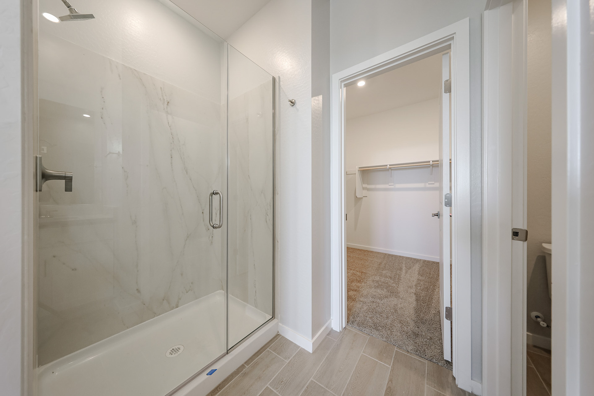 A bathroom with a shower unit.