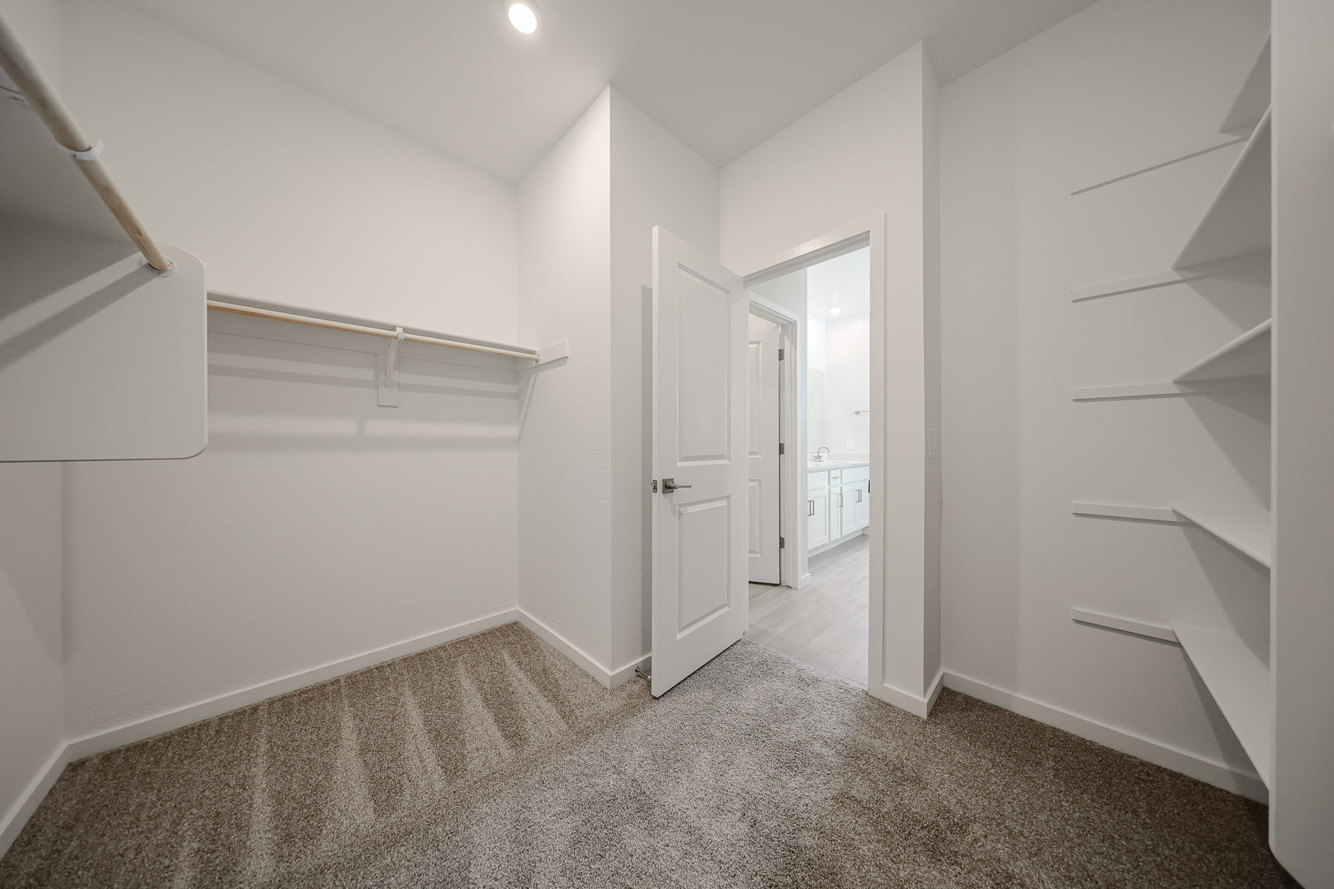 A hallway with white walls.
