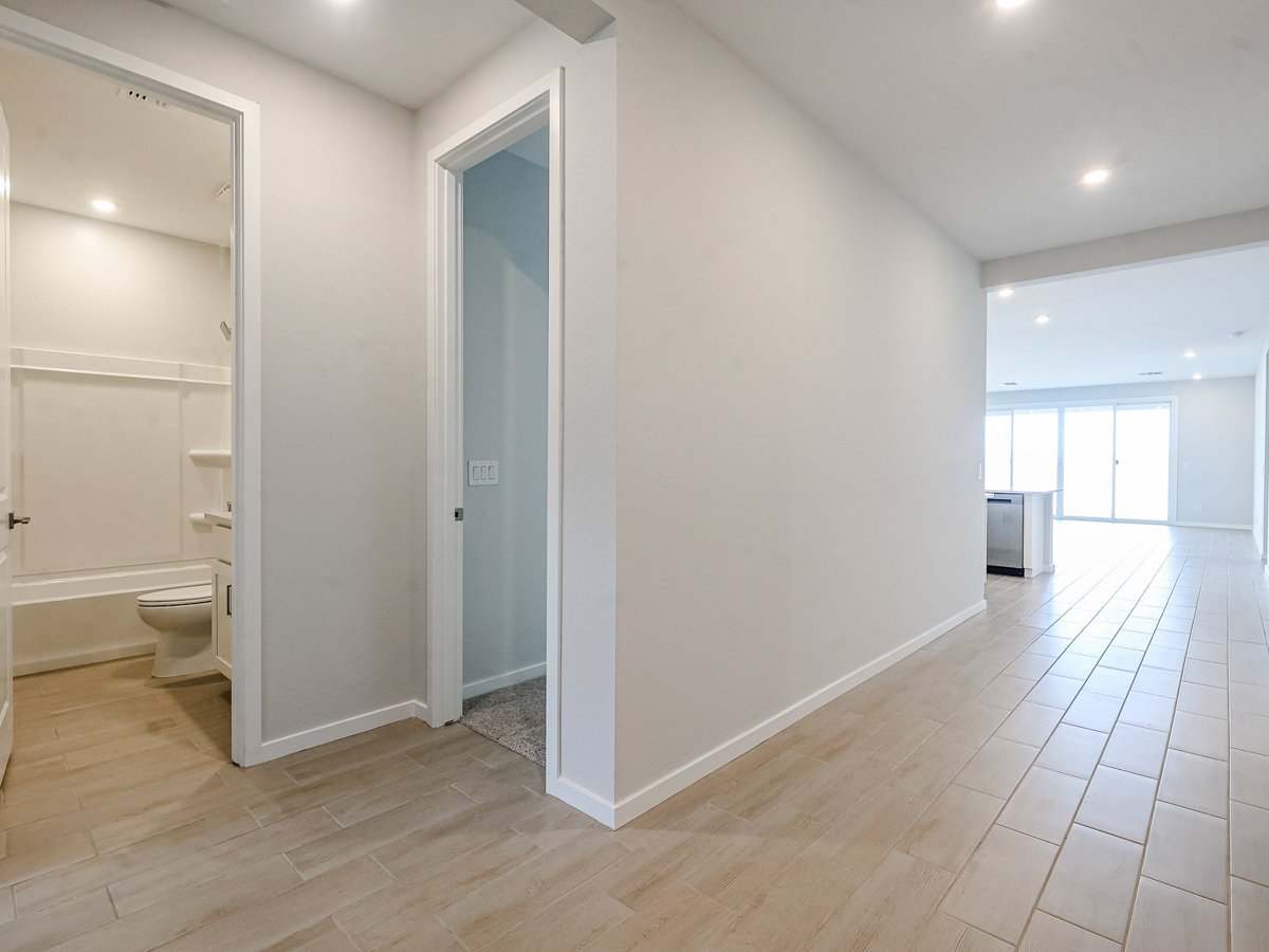 A bathroom with a toilet and shower.