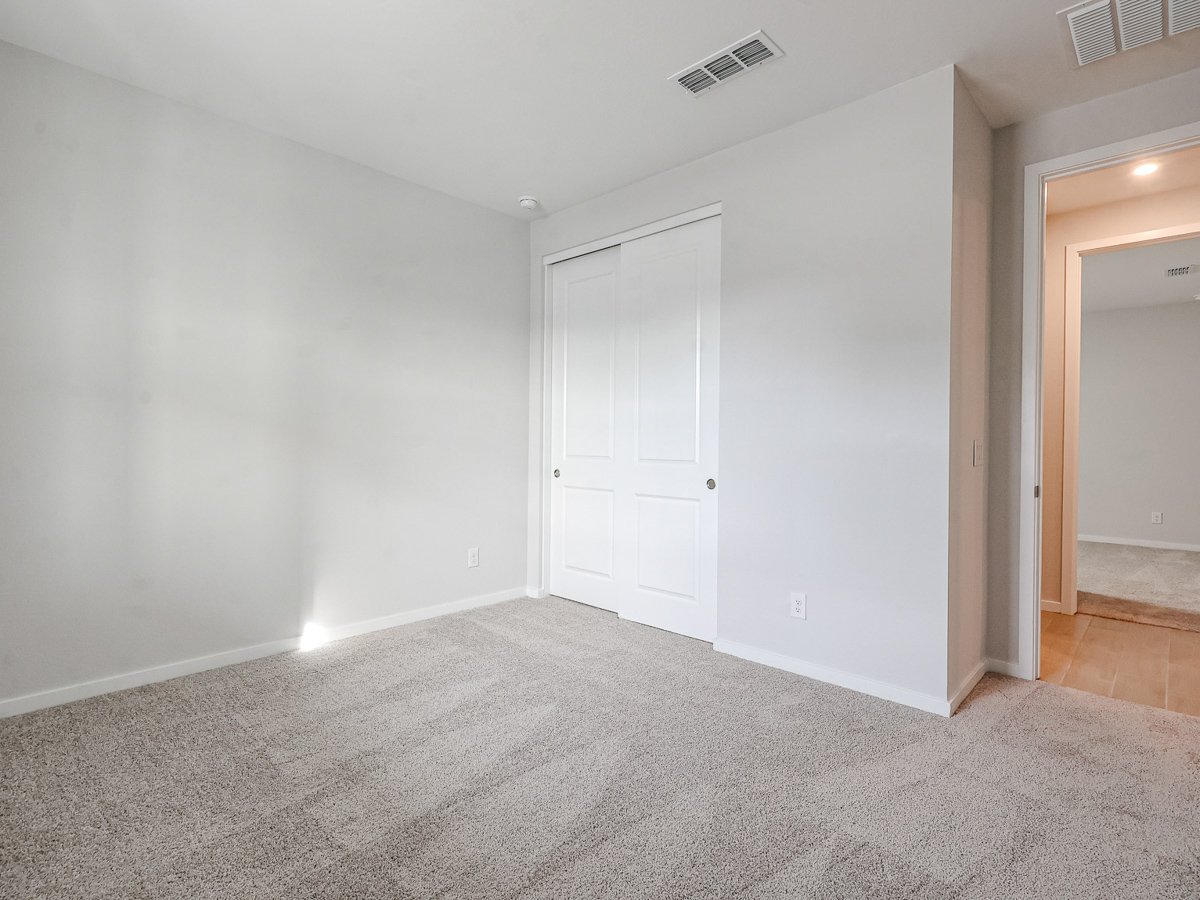 A room with a white door and a white door.