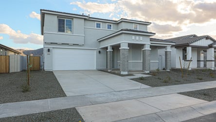 A white house with a driveway.