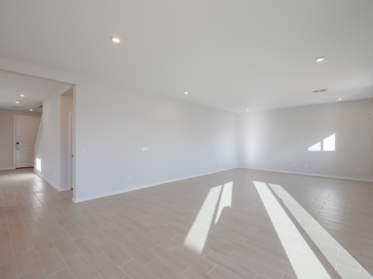 A hallway with white walls.