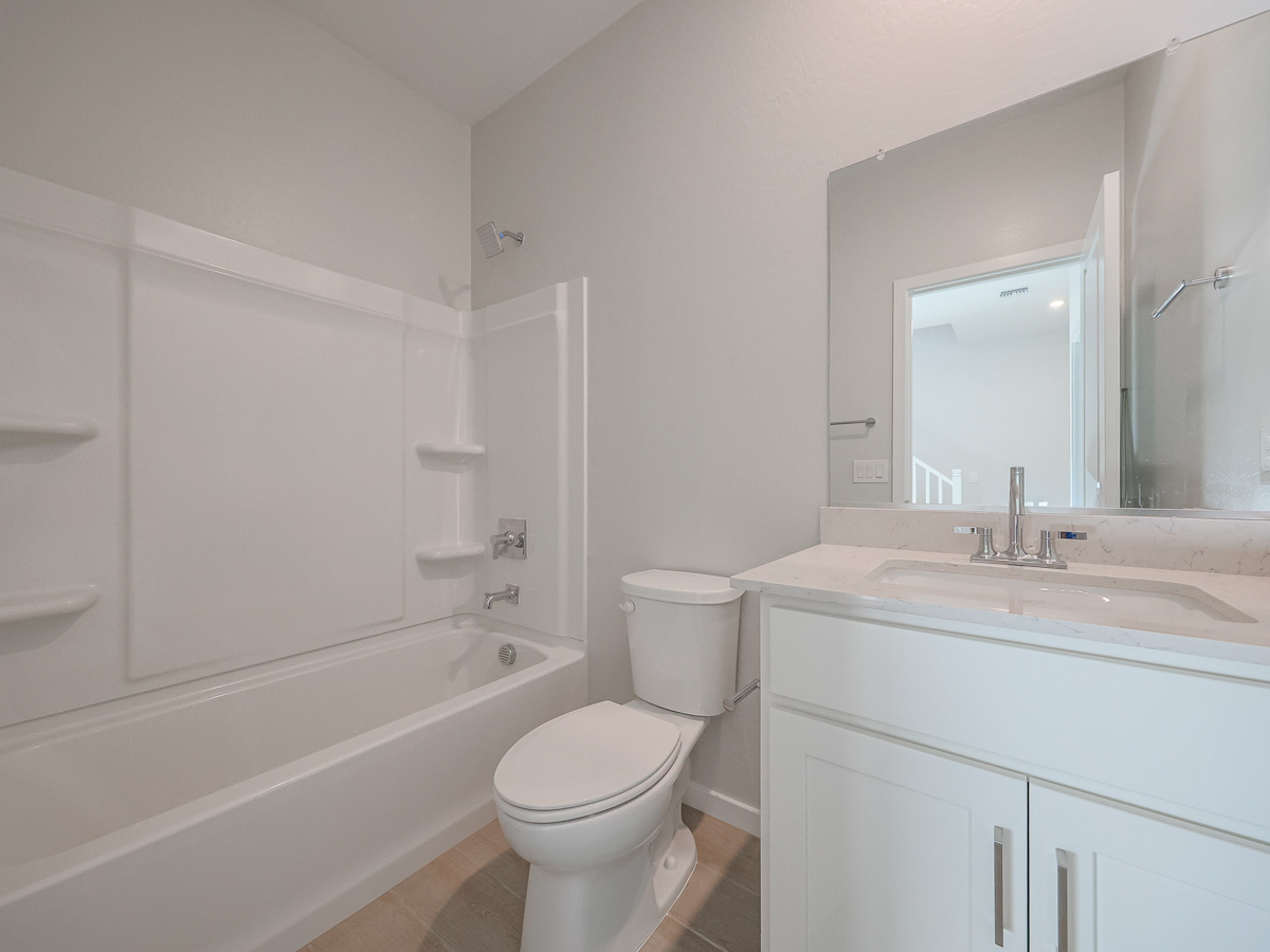 A bathroom with a toilet and sink.