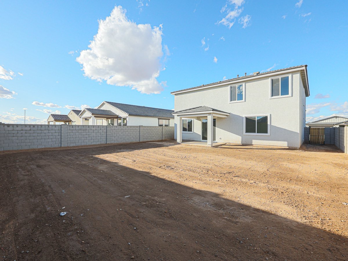 A house with a dirt yard.