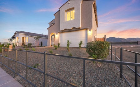 A house with a fence around it.