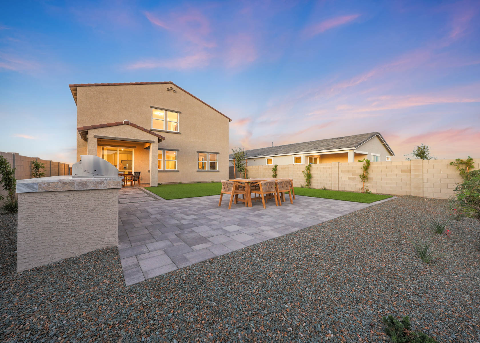 A house with a patio and chairs.