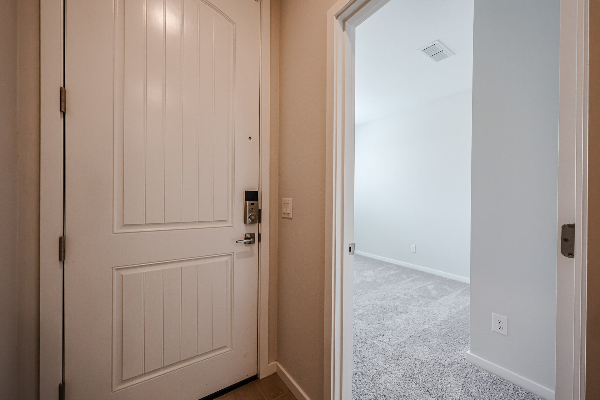 A hallway with white doors.