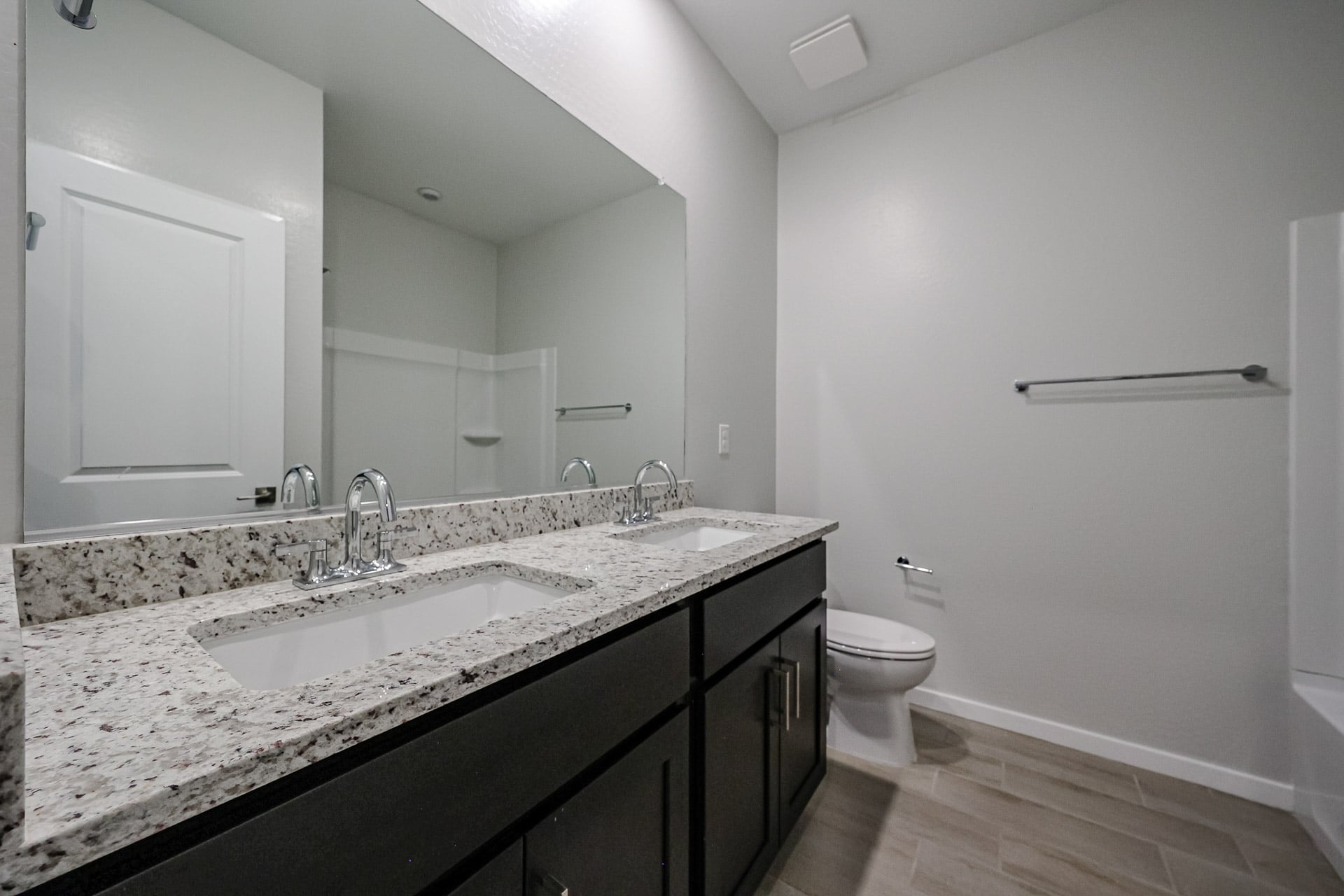 A bathroom with a marble countertop.