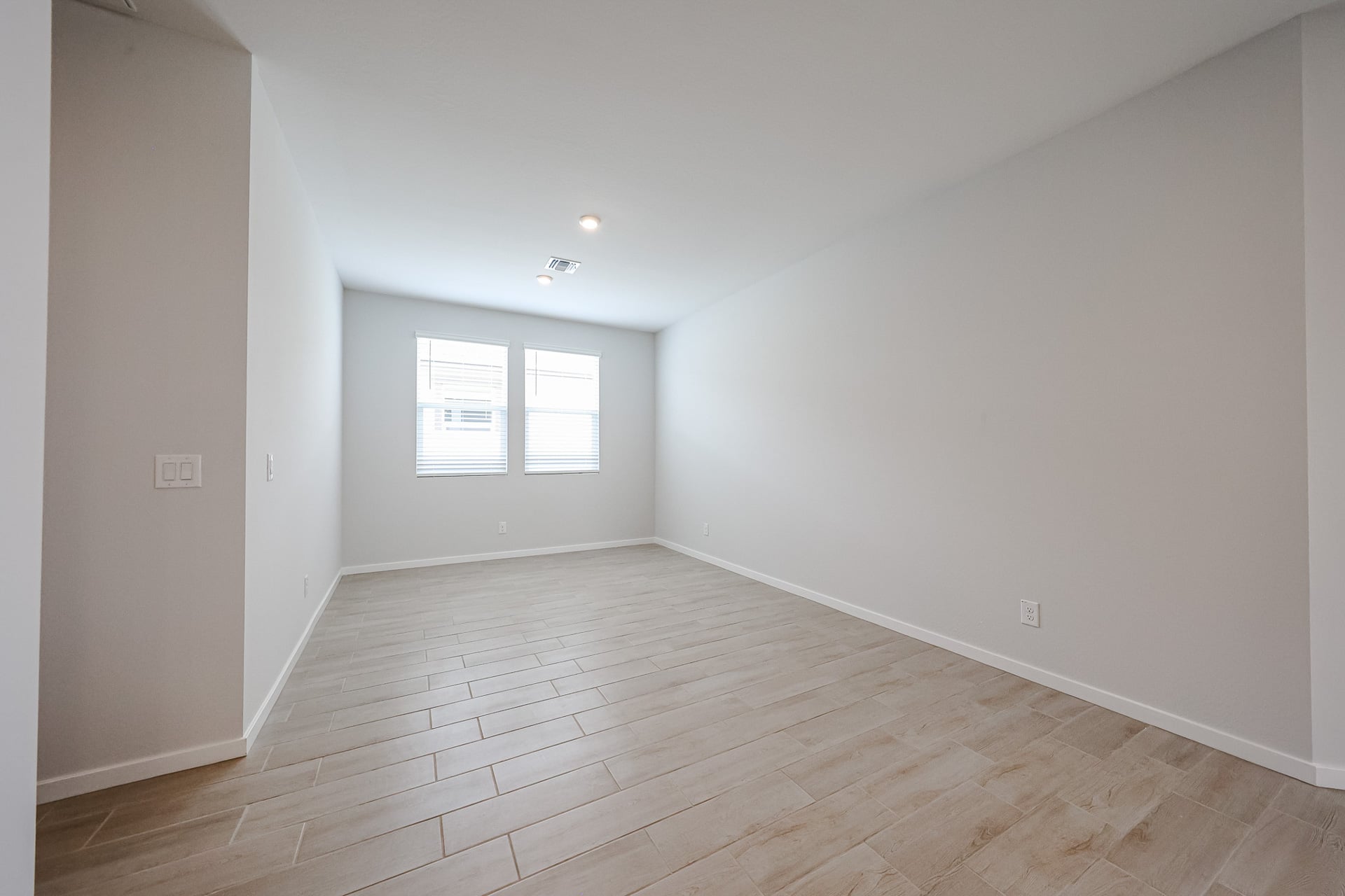 A room with a wood floor and a wood floor.
